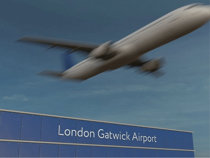 Gatwick Airport with flying plane